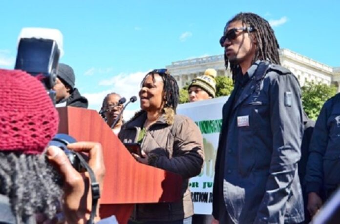 Judith De Four-Howard, K8 teacher (Crotona Park West), Coalition for Educational Justice rep. With Alden Nesbitt (right) of T&T