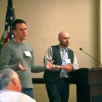 Returned Volunteers Scott Stadum and Shane Loorz addressing the gathering