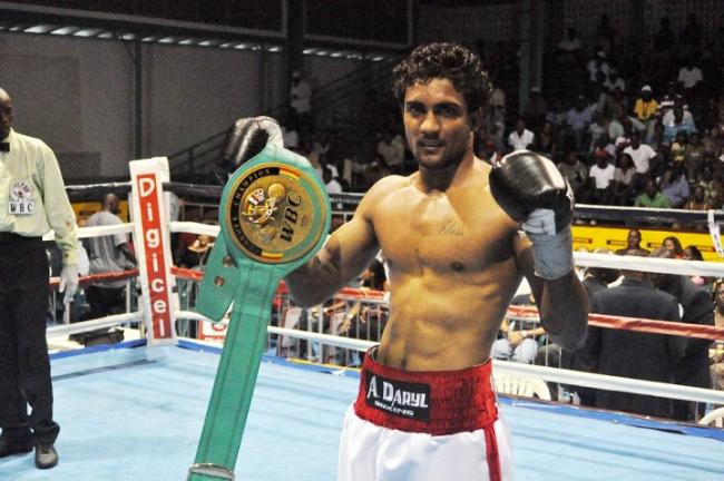 Elton Dharry with his championship belt at the Cliff Anderson Sports Hall